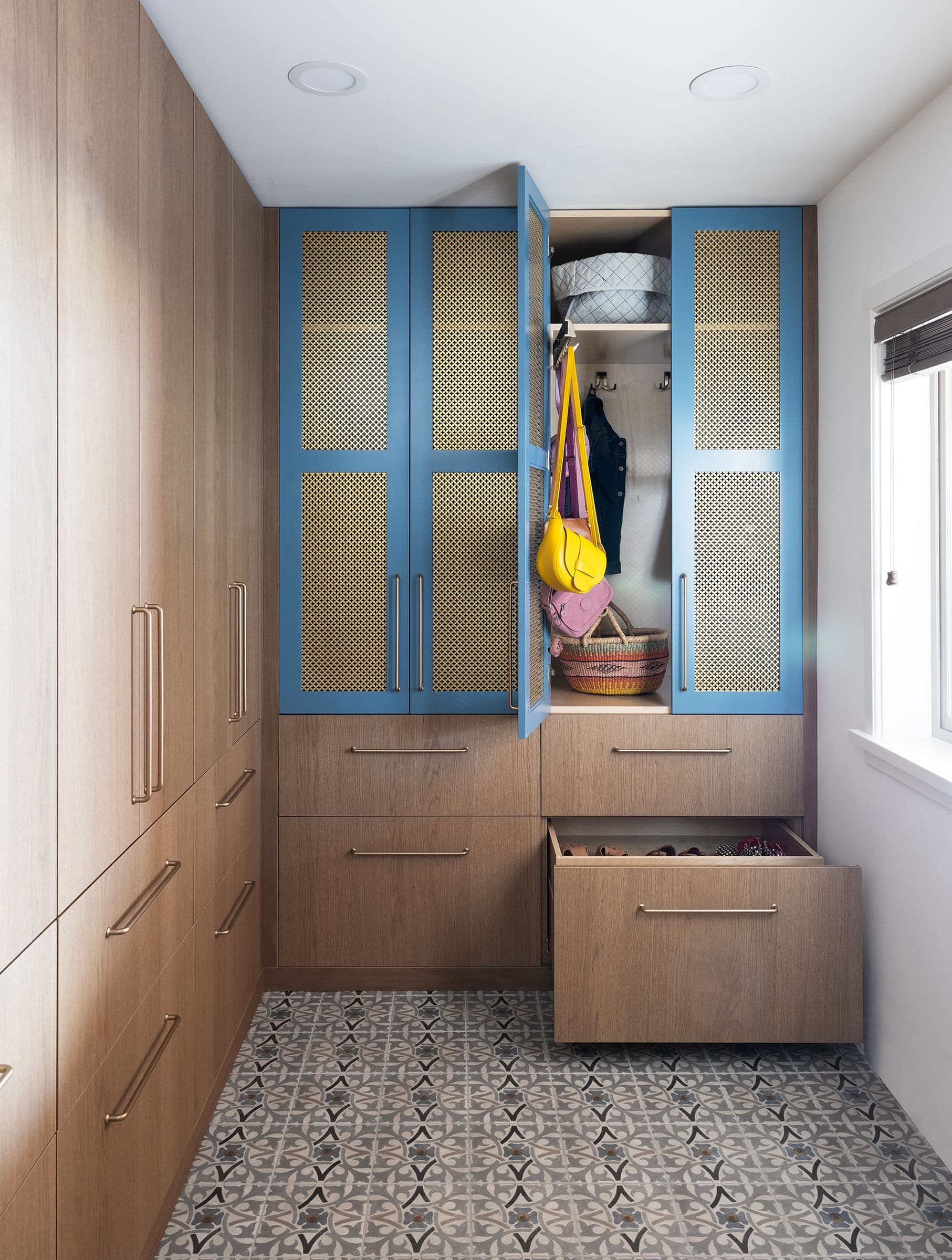 Mudroom with blue mesh-front cabinets open, Lee residence